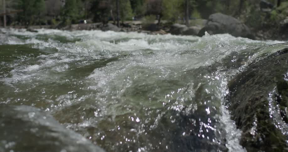 Water splashes over the rocks in a creek