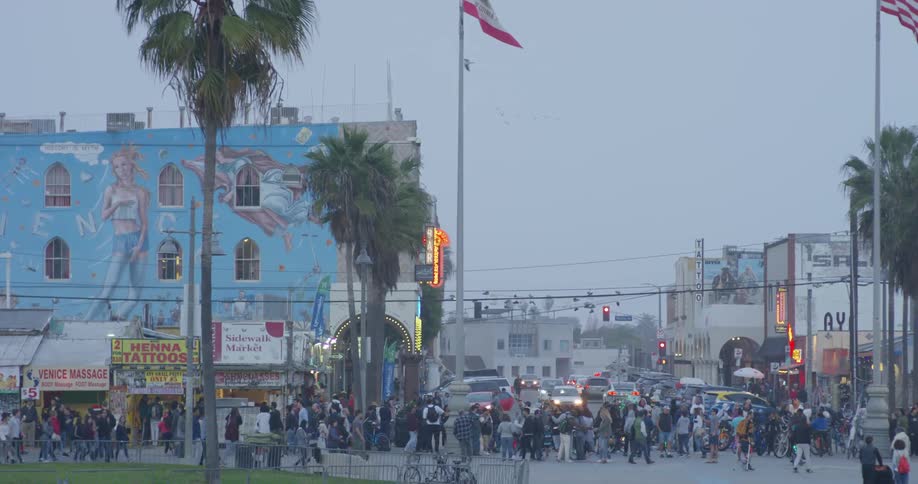 The town has many people walking in the street