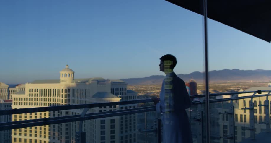 A woman stands on a hotel balcony in las vegas