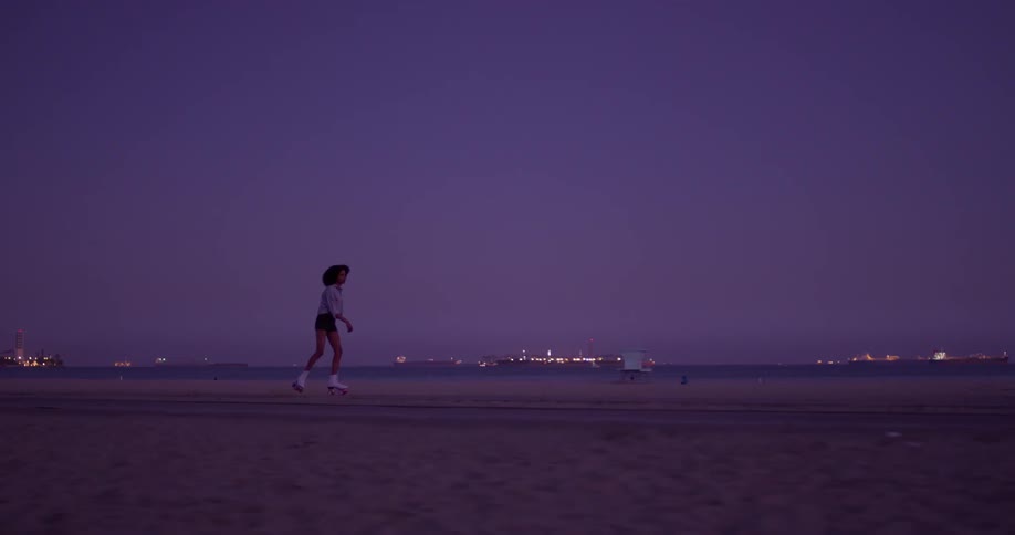 Woman Rollerblading Around Beach