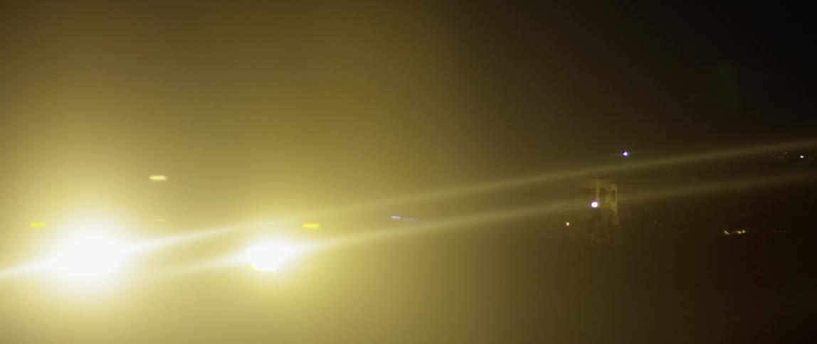 Vehicle drives in the city at night