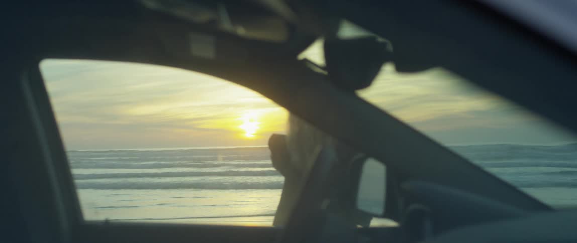 Woman Watching Sunset At Beach