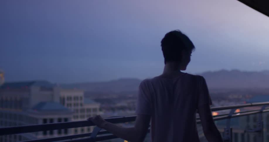 A woman stands on a hotel balcony in las vegas