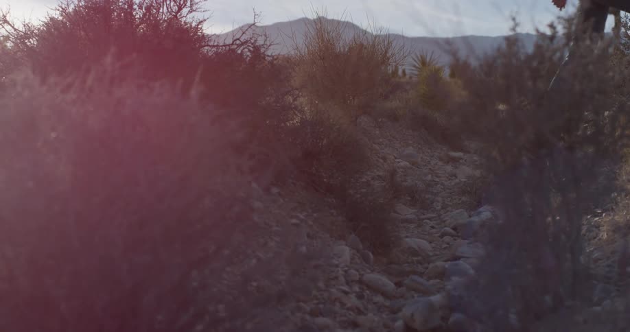 A person is hiking over the small hills