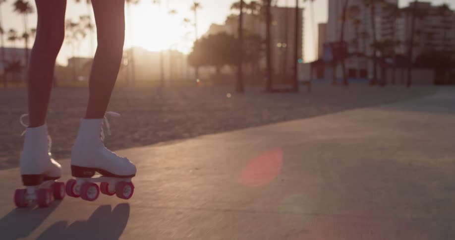 Woman Rollerblading Around Beach