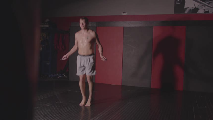 A man jumps rope in a gym
