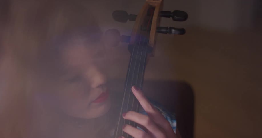 A woman plays the cello