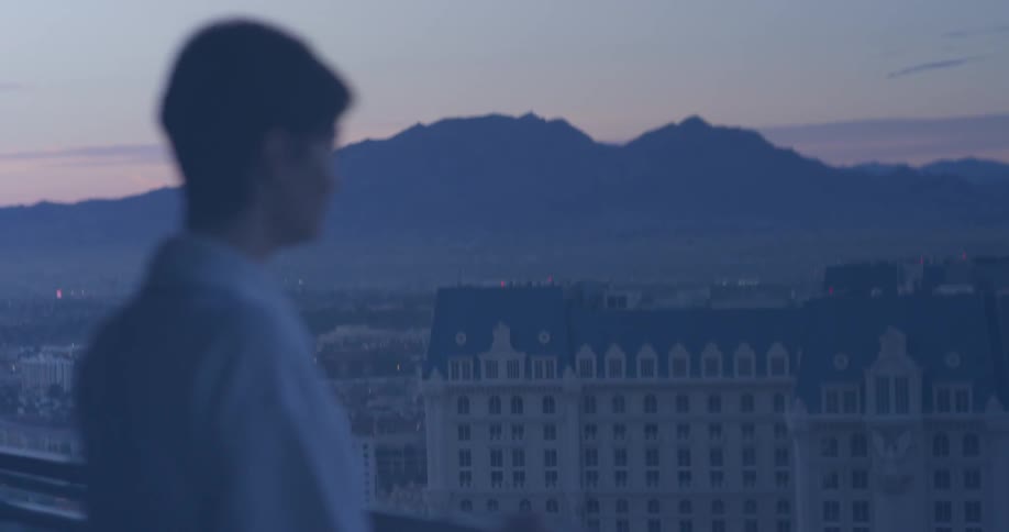 A woman stands on a hotel balcony in las vegas