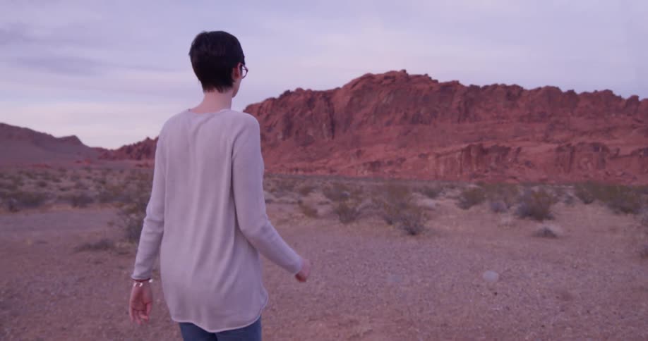 A woman hikes in the desert