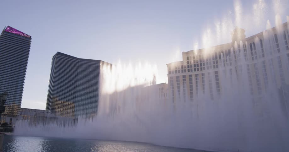 The water shoots high into the air from the fountain