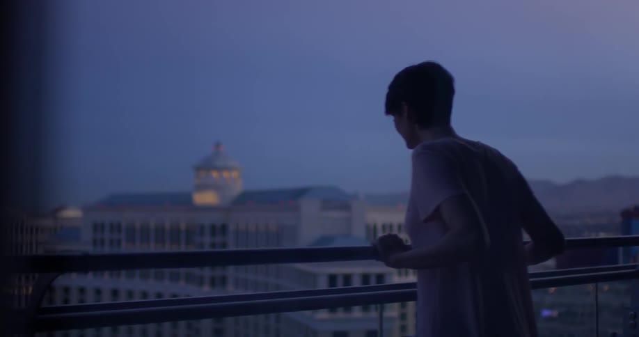 A woman stands on a hotel balcony in las vegas