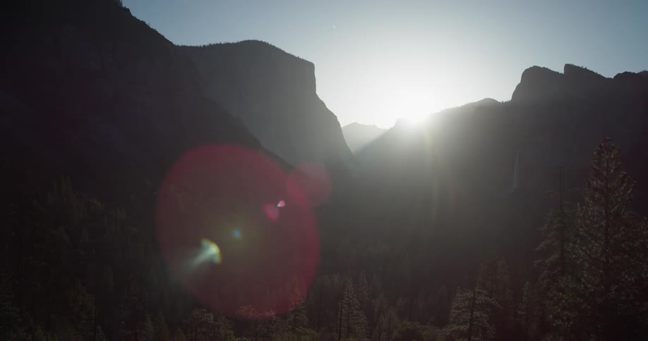 The bright sun shines on the mountains