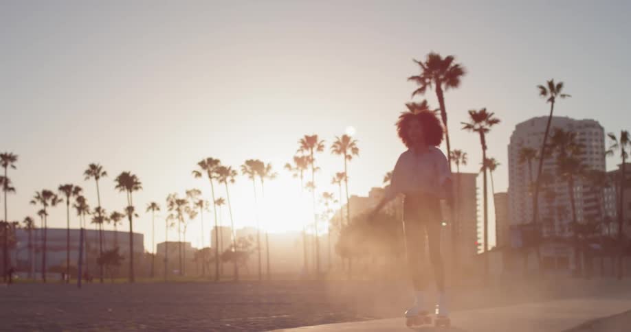 Woman Rollerblading Around Beach