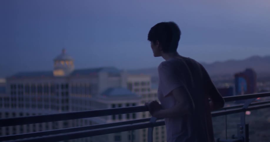 A woman stands on a hotel balcony in las vegas