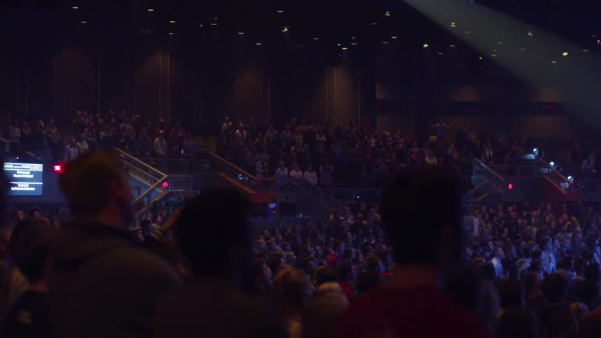 An auditorium full of people watching a performance
