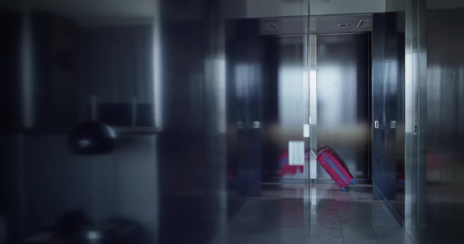 The woman passes by in the hall ahead