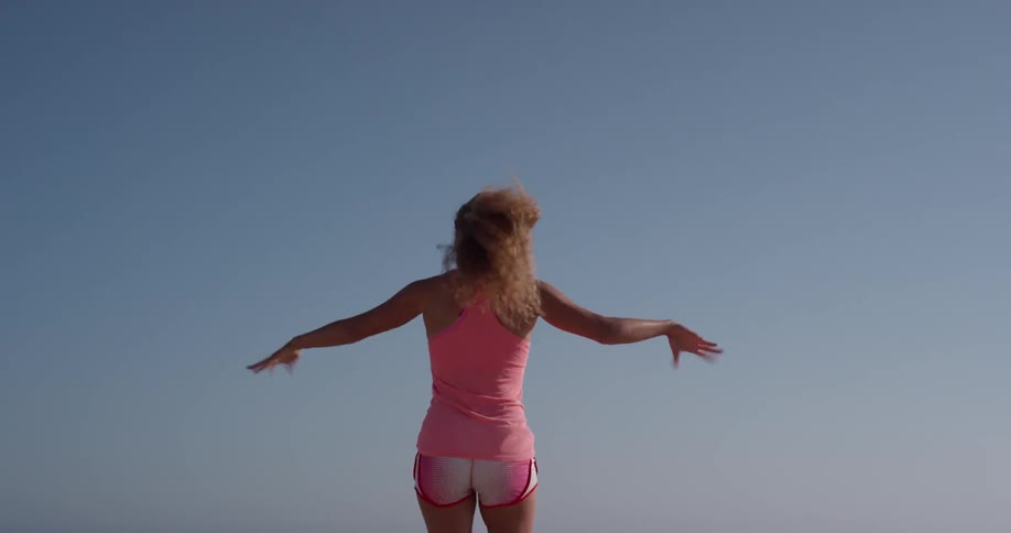 Woman shakes her hands and jogs in place