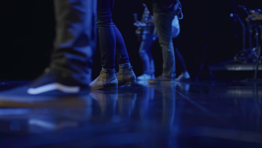 The people stand together on the stage
