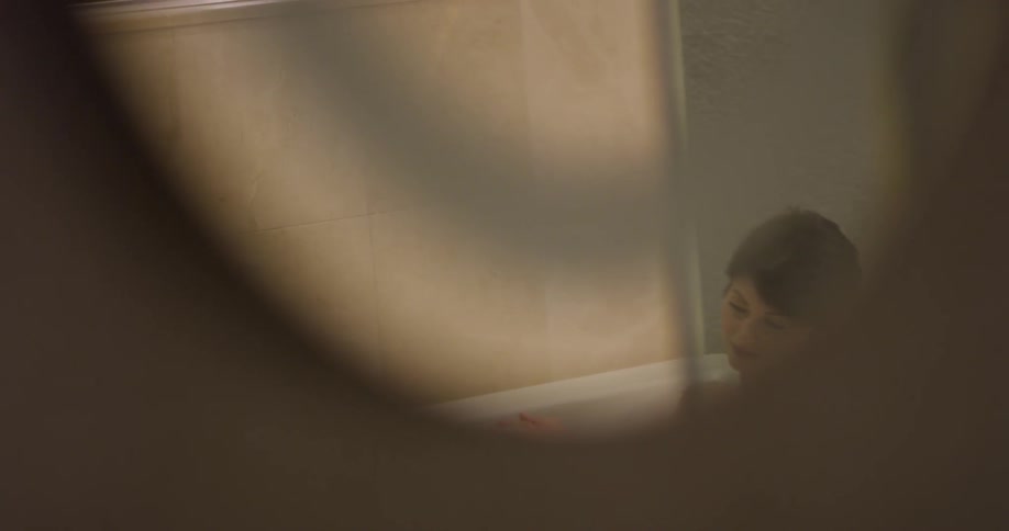 Woman takes a bath in a bathtub