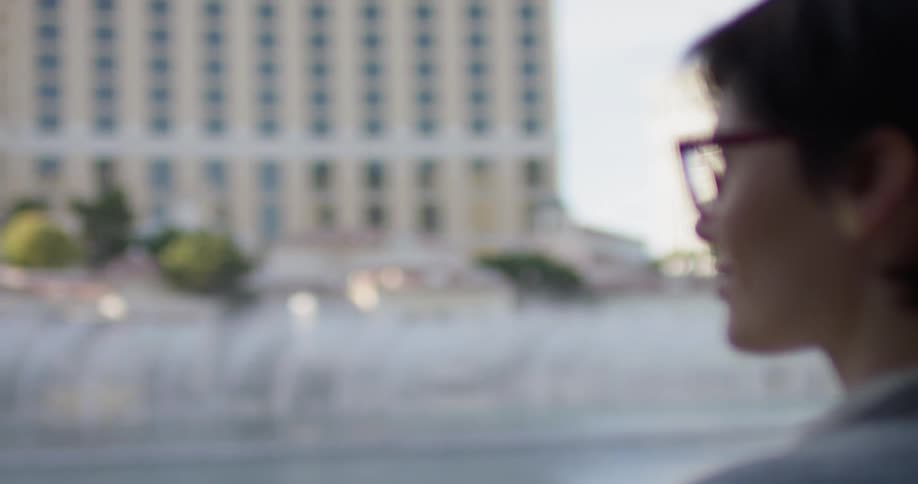 A woman watches fountains in las vegas