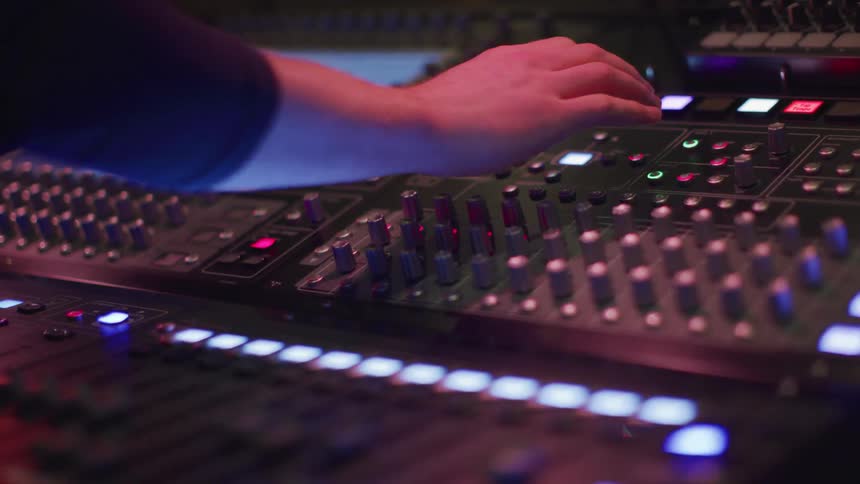 The person is working using the soundboard