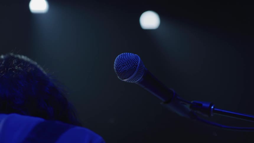 A musician performs on a stage