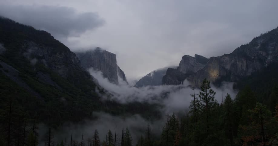 Clouds float over mountains in the wilderness