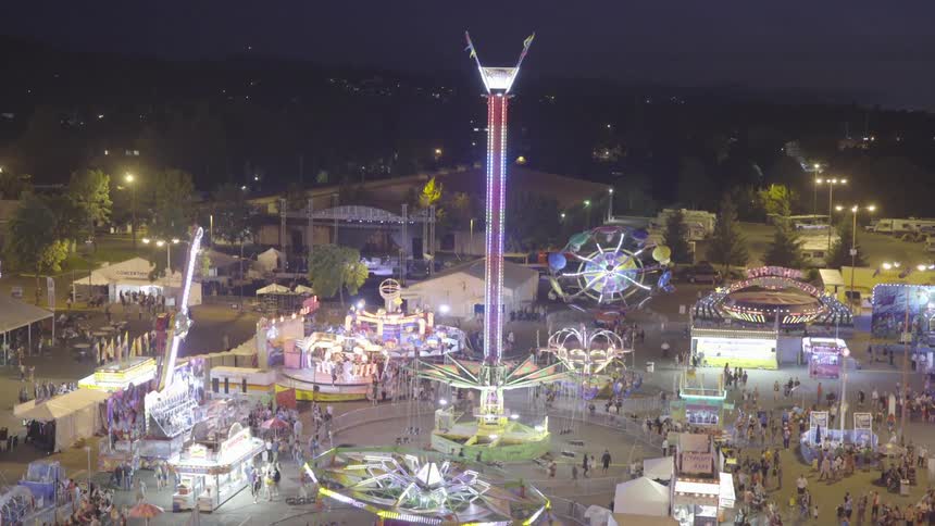 Fair rides shine and twinkle at night