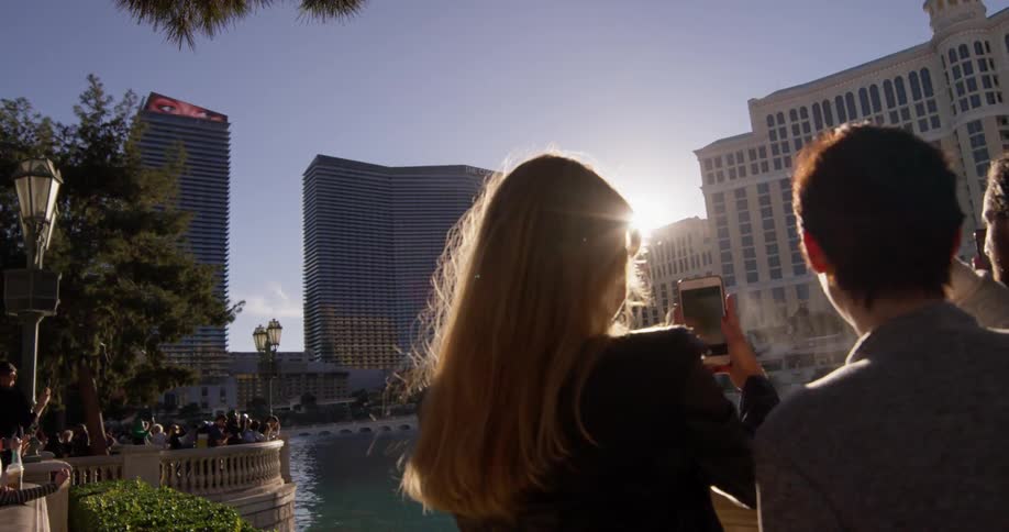 Two women watch the fountains in las vegas