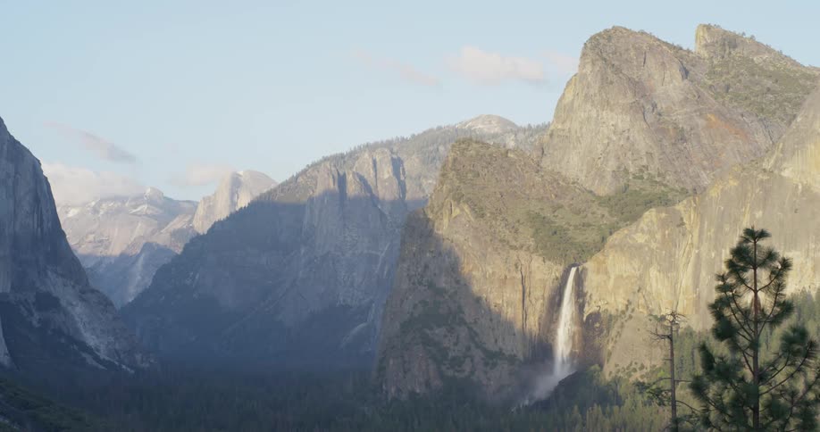 The mountains ahead have a waterfall