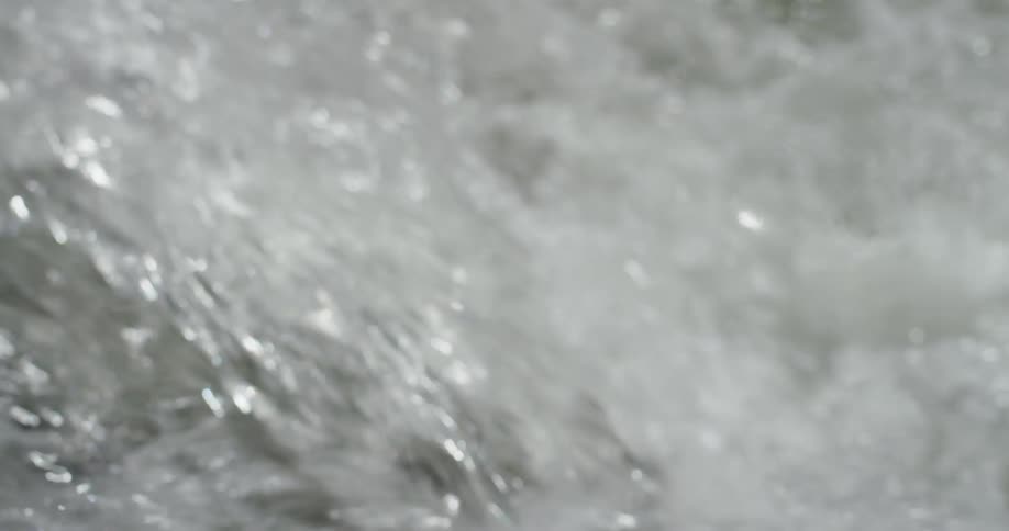 Water is rushing and splashing on sunny day