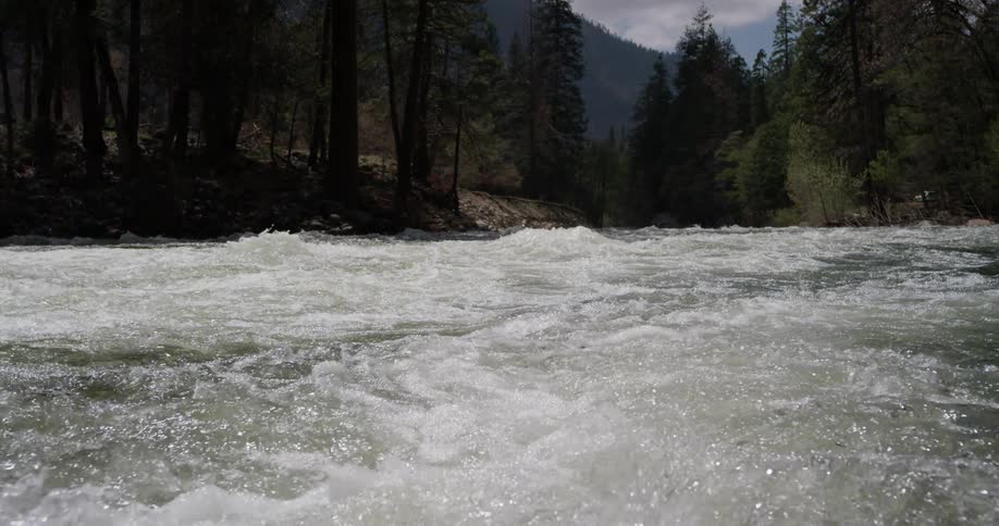 The water is splashing all over in the stream