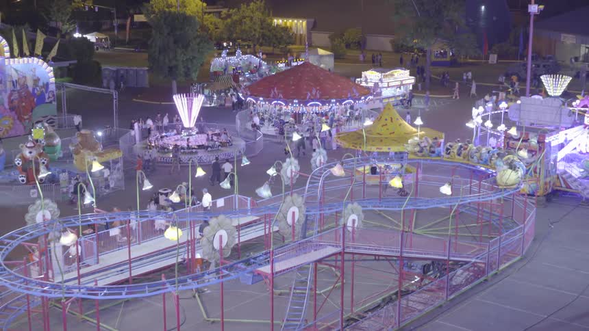 The rides of the carnival are full of people