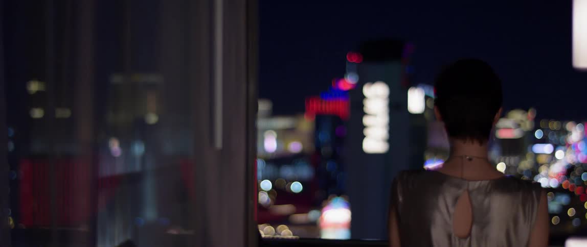 A woman stands on a hotel balcony in las vegas