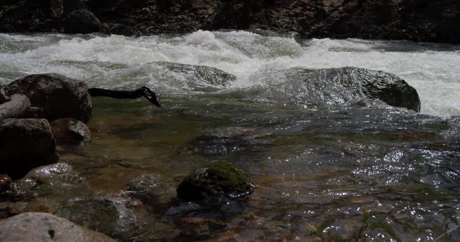 The water slowly pours over the rocks