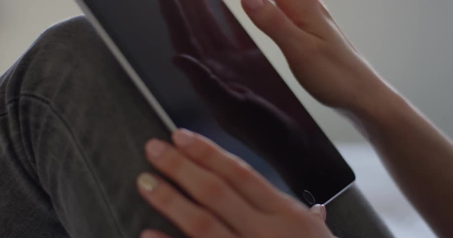 Woman Using Tablet In Apartment