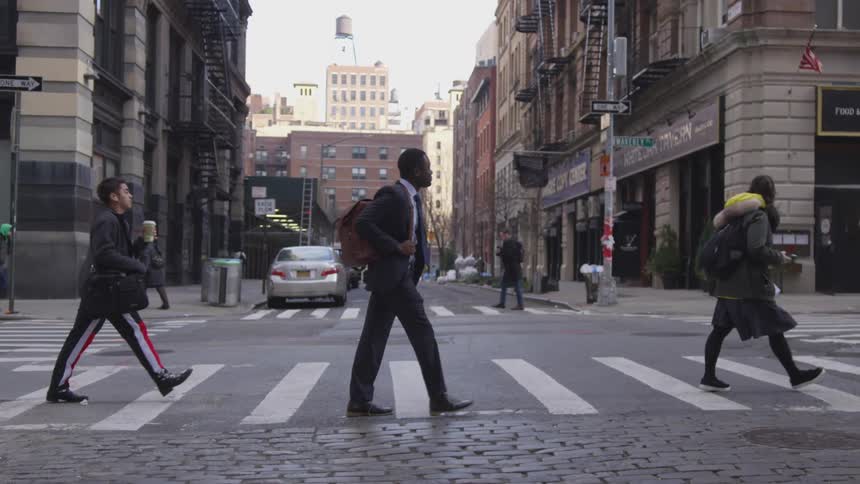 Pedestrians cross a city street
