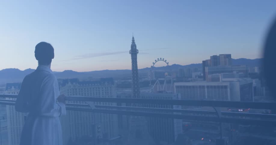A woman stands on a hotel balcony in las vegas
