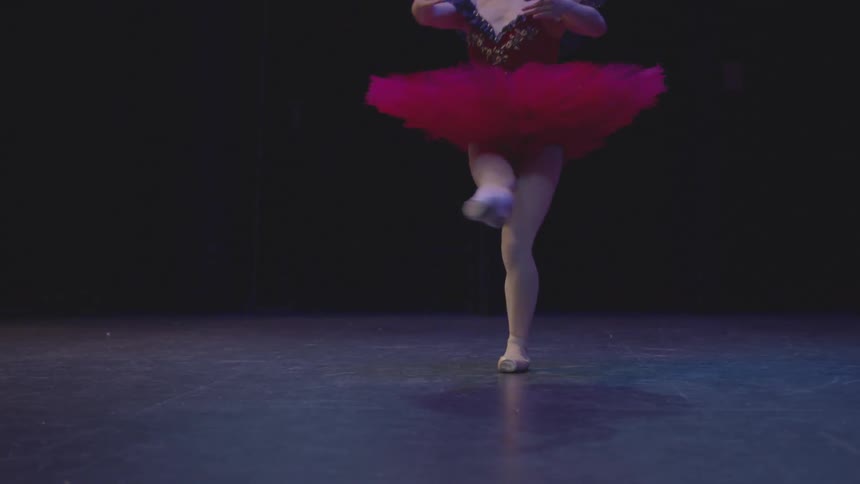 Ballerina spins around and points her toes