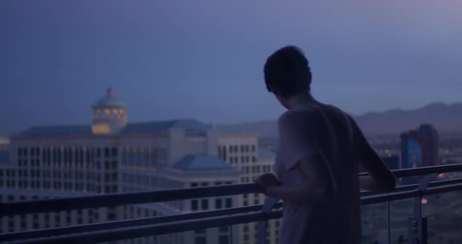 A woman stands on a hotel balcony in las vegas