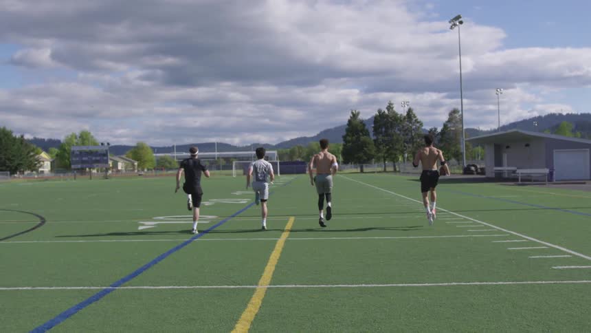 The four men race down the field