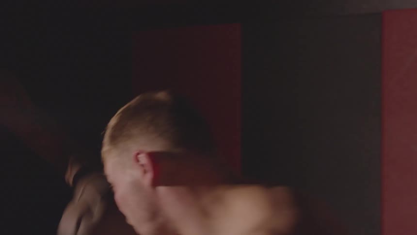 A man punches and weaves as he spars