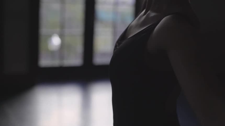 A ballerina dances in a dance studio