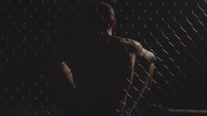 A man leans against the fence