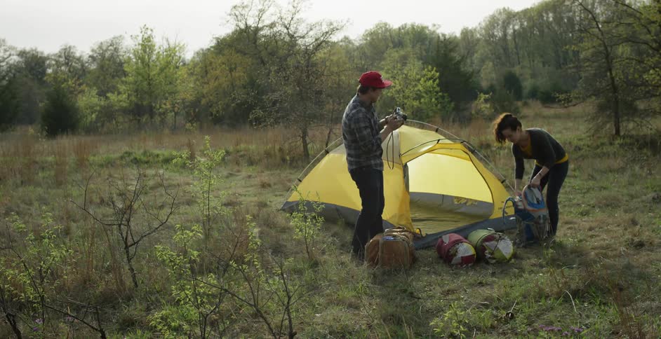 A man and woman at a campsite