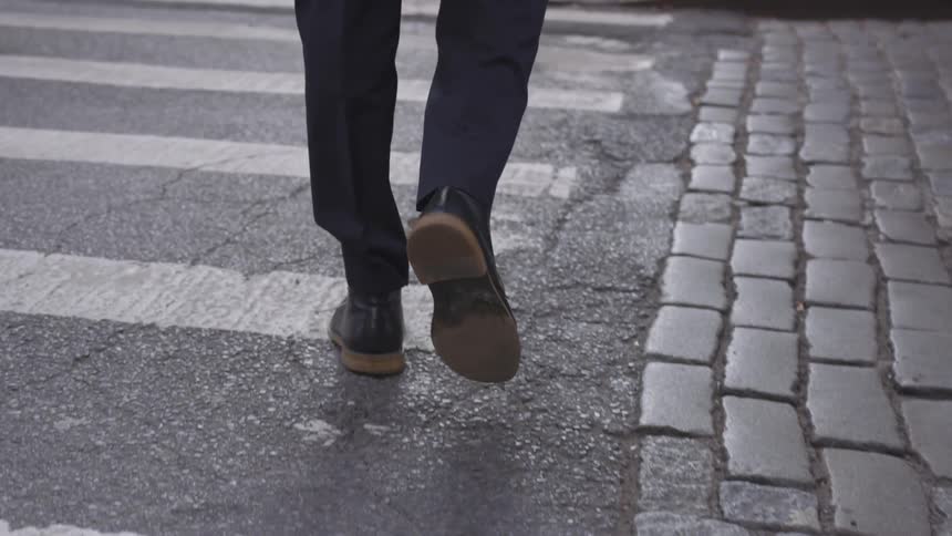 A person is crossing the street