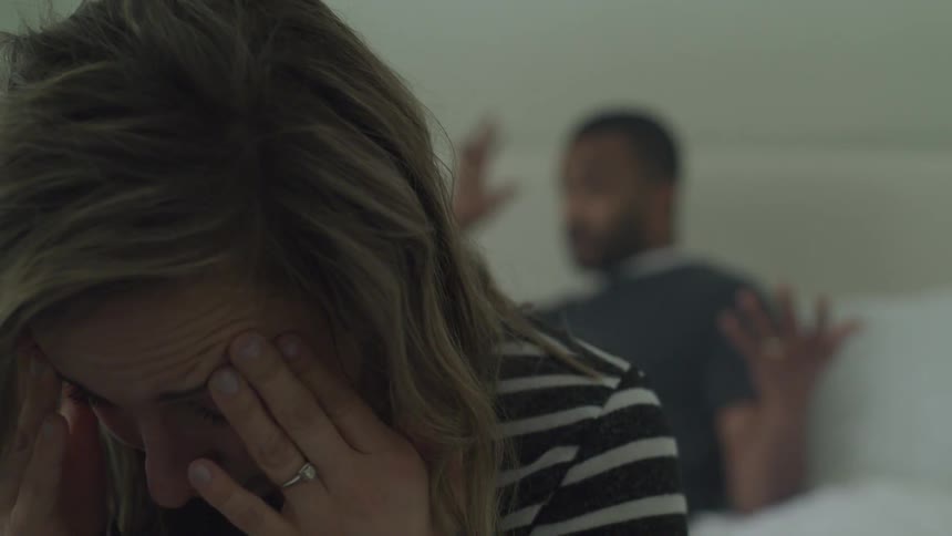 The man is arguing with a worried woman