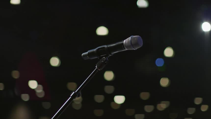 The microphone sits on the stage