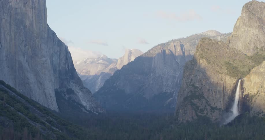 Mountains stand tall under the blue sky