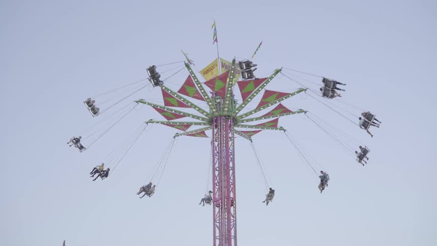 The carnival ride is swing people in the sky